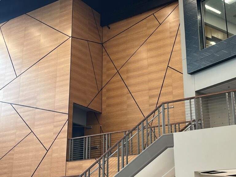 high end wall system with stairs leading to backroom.