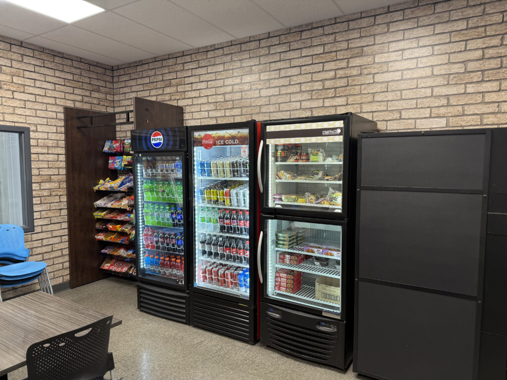 employee breakroom with vending machines and brick wall panels